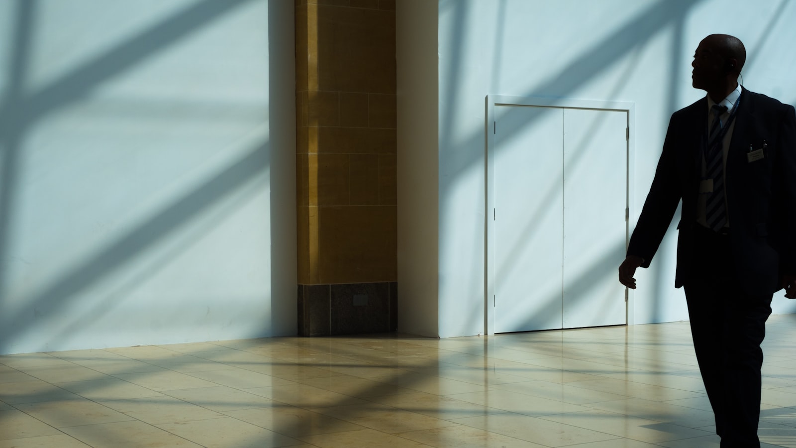 Security officer walking a corridor during a night shift